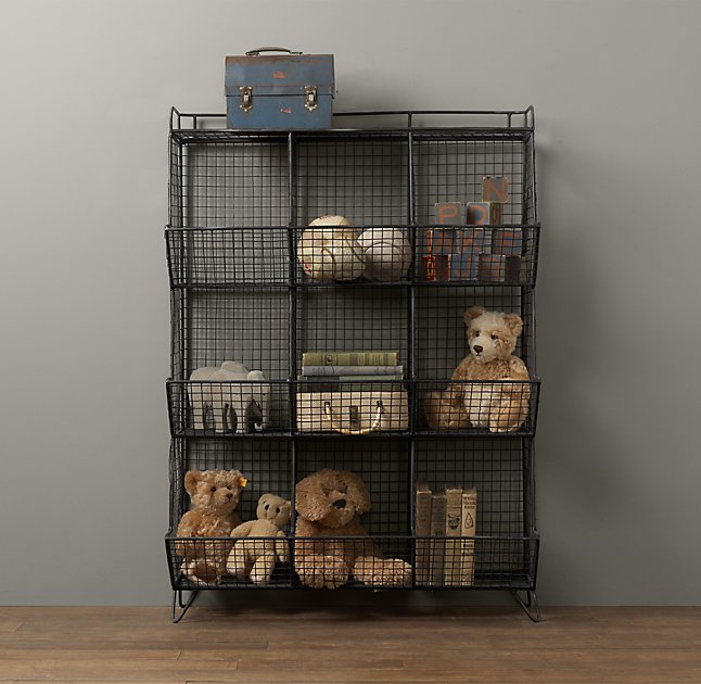 black wire shelving unit with baskets holding children's toys