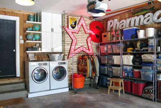 organized garage with washer and dryer decorated walls and chrome storage shelves
