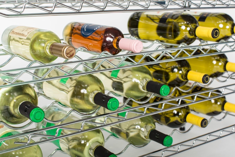 chrome wire shelving being used to store bottles of wine on their side