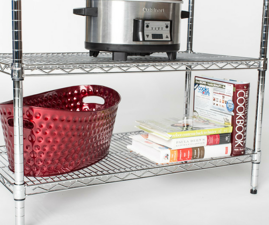 open wire shelf with cook books, basket, and crock pot on display