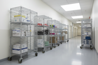 Mobile security cages in warehouse corridor